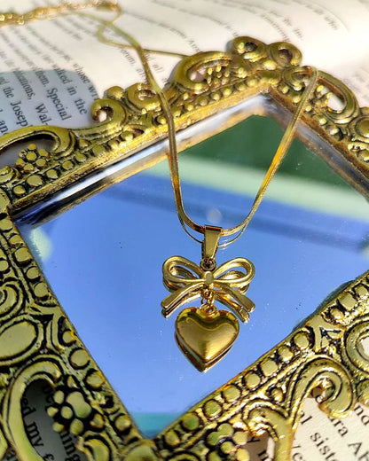 BOW HEART PENDENT NECKLACE (Gold Platted)